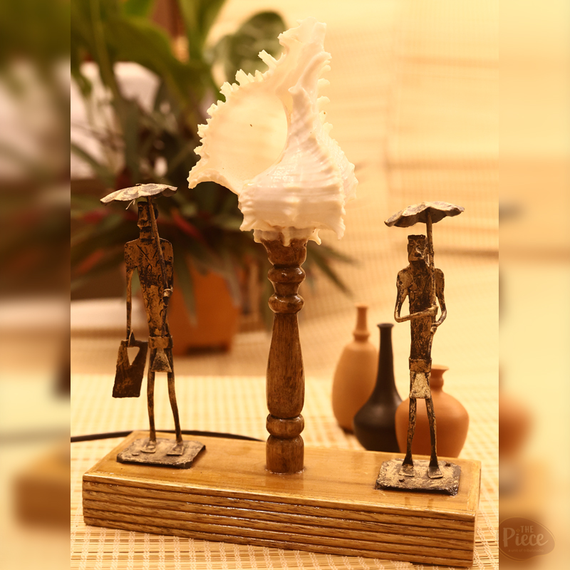 Handcrafted tribal shell table lamp with figurine design